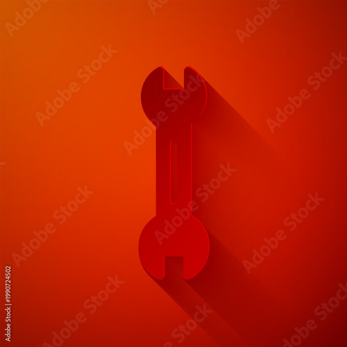 Paper cut Wrench spanner icon isolated on red background. Paper art style. Vector