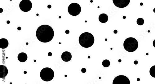 A repeating pattern of black circles of varying sizes on a white background