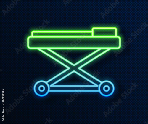 Glowing neon line Stretcher icon isolated on blue background. Patient hospital medical stretcher. Vector