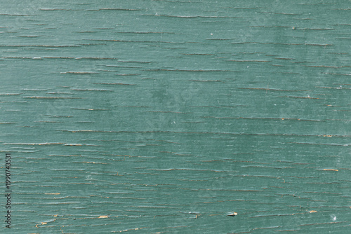 La texture du bois avec peinture verte abîmée et usée.