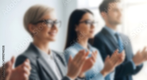 Diverse group of professionals applauding at a conference or business event showing support and enthusiasm