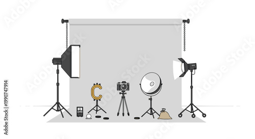 An organized photography studio setup displays a central digital camera surrounded by professional lighting equipment and a grey backdrop in bright light.
