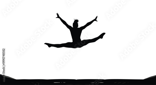 Silhouette of a gymnast performing a split leap in mid-air with silhouette