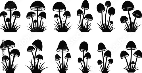 Set of black mushroom silhouettes with grass stalks isolated on white background for mystical forest nature design projects
