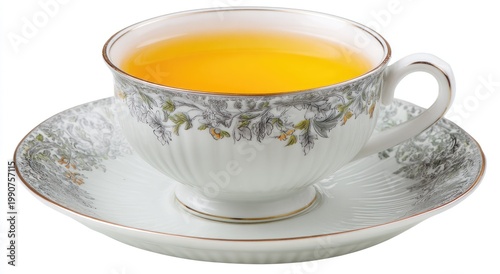 Elegant porcelain teacup filled with golden, steaming liquid on matching saucer