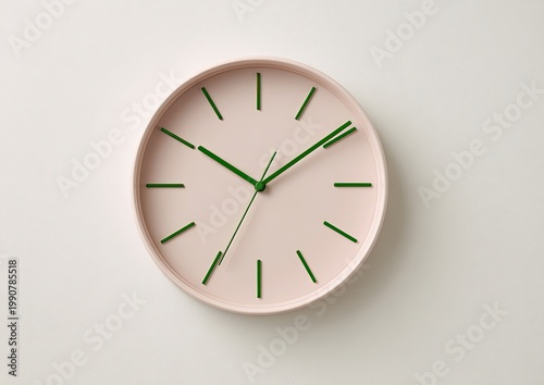 Minimalist pink wall clock with green hands and hour markers