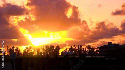 Beautiful orange sunrise on a horse farm