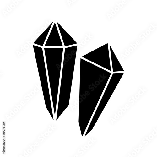 Two sharply pointed black crystal stones isolated against a white background