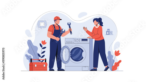 Professional service technician wearing overalls and a cap fixing a washing machine with a wrench while talking to a female customer at home.