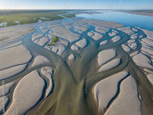 Aerial view of a braided river delta with sandy islands