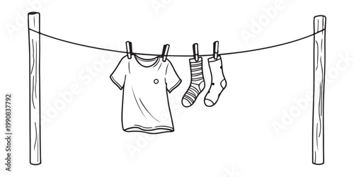 A simple line drawing depicts clothes hanging to dry outdoors on a clothesline