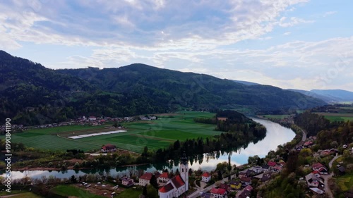 aerial river bend with village and church