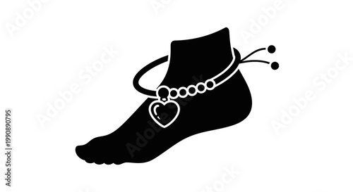 Black anklet adorns a foot showcasing delicate jewelry design silhouette