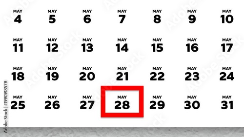 The date May 28th marked with a red cursor on the wall calendar 2026