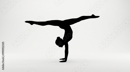 Silhouetted figure performing handstand with wide leg split, bright white background, minimalist composition emphasizing strength, balance, and flexibility.