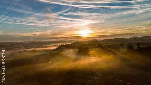 Cuadro en lienzo "Aerial sunrise over a misty Bavarian village - Spring morning in Germany with f