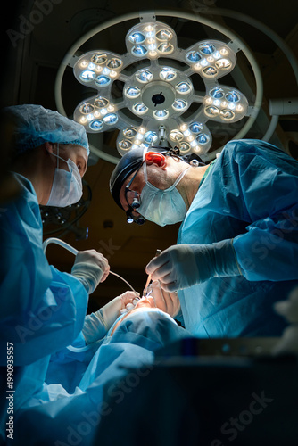 plastic surgeon performs surgery in the operating room