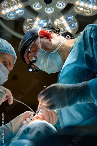plastic surgeon performs surgery in the operating room