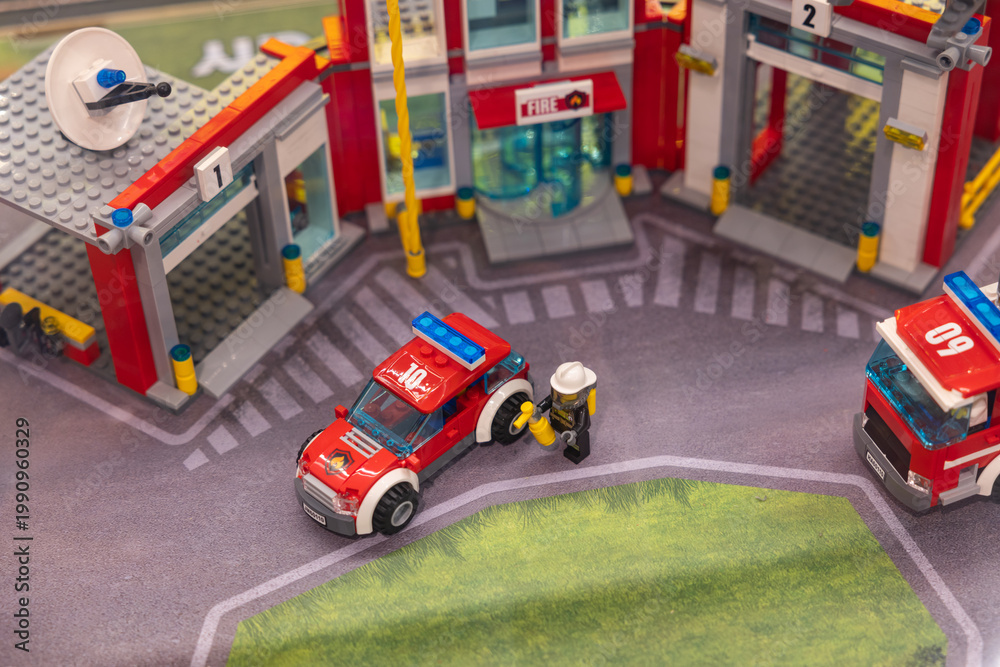 Fototapeta premium LEGO City fire truck with ladder and fire station display