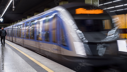 Modern metro station with passenger, Munich