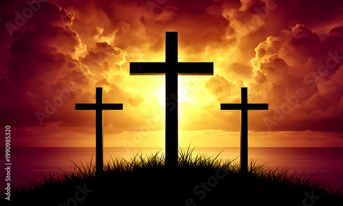 Three Christian crosses silhouettes on a grassy hill overlooking the sea during a dramatic sunset