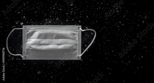 Surgical mask in white shown on black background with clipping path effect