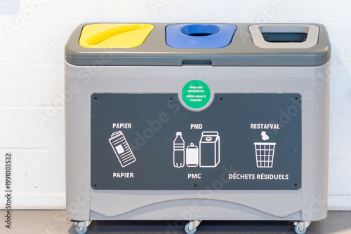 Obraz na płótnie Modern three-compartment waste segregation bin for recycling in public spaces