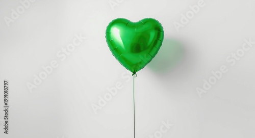 Romantic green balloon on smooth white backdrop capturing essence of love declaration