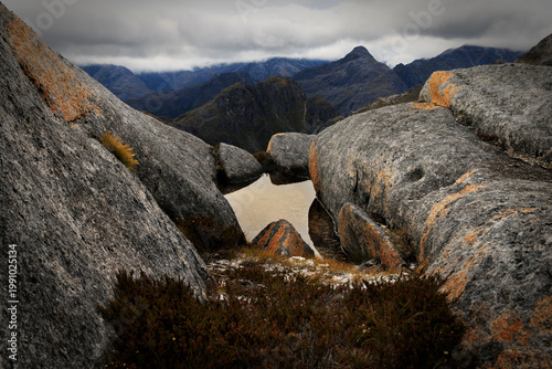 Rock Pool and Jagged Peaks in Fiordland National Park