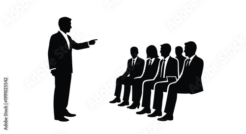 A presenter addresses a group of seated individuals in a silhouette