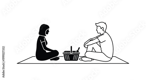 Two individuals seated facing each other with a picnic basket between them