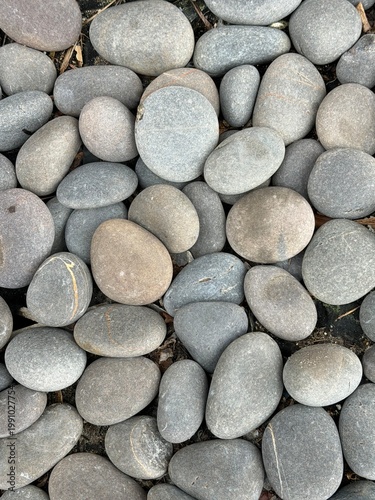 Smooth river stones texture natural background