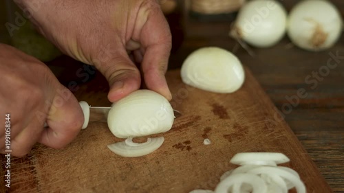 men cutting onion at kitchen