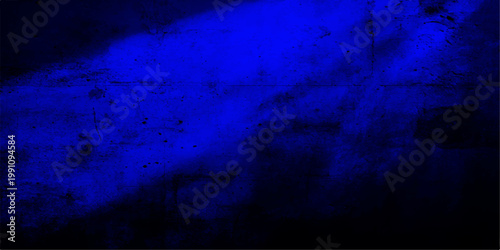 Abstract deep blue textured background. An artistic blend of shadows and light creates a sense of depth and mystery. The image suggests infinite possibilities for creativity.