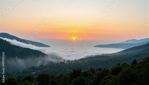 Breathtaking Mountain Sunrise Over Lush Valley with Clouds Blanketing the Scenic Landscape and Vibrant Colors Illuminating the Serene Morning Horizon