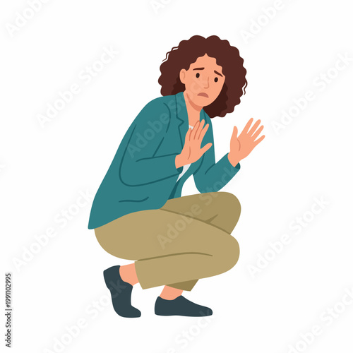 A worried woman squats, displaying fear and anxiety with her hands raised defensively, capturing a moment of vulnerability and the emotional weight of uncertainty in life.