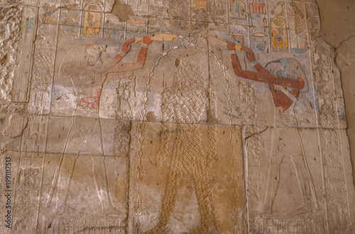 Pharaonic image of the place where Hatshepsut once stood, who was blessed with longevity by Horus and Thoth, an arch of ankhs. Ancient Egyptian reliefs at the Karnak Temple.