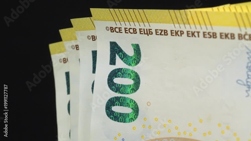 Euro banknotes, EUR. One thousand Euros in five 200 euro banknotes. New yellow two hundred Euro banknotes. European Money. Cash, finance, savings, wealth