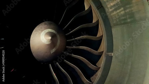 Canvastavla Close-up of a turbofan aircraft engine fan in the dark, showcasing symmetrical b