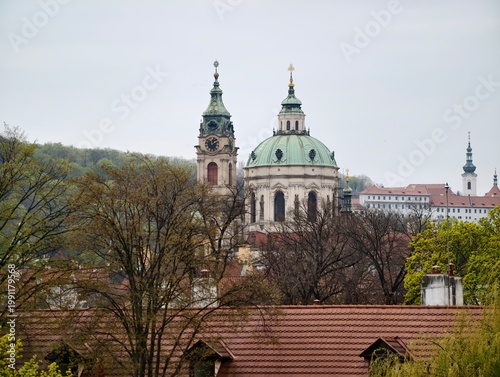 Baroque towers crown cityscape. Renaissance style domes and towers overshadow surrounding rooftops