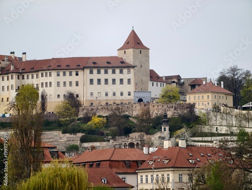 Ruinous castle perched above terraced lands showcasing timeless resilience and historic charm