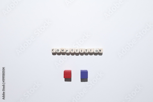 Fotografia COMPETITION word with red and purple cubes representing rivalry, challenge and opposing sides