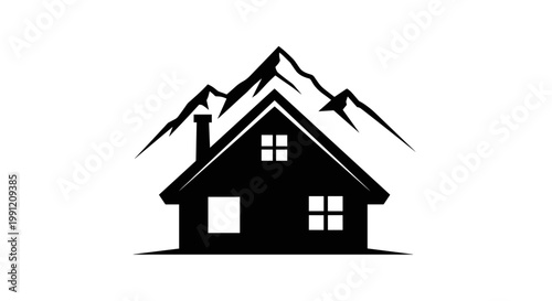 Black house with mountain silhouette.