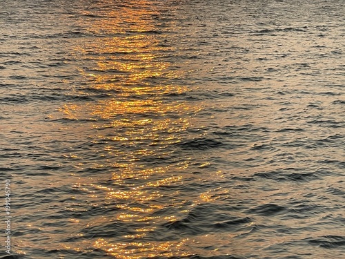 Sea surface with sunlight sparkle. Abstract blue sea water background, nature background concept.
Water surface texture. Sun glare on the sea surface. Selective focus.