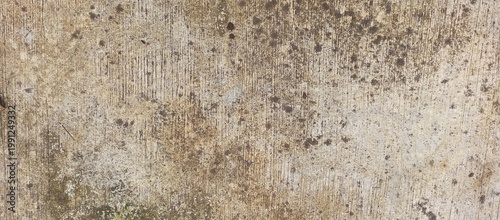 Grungy beige concrete wall with vertical patterns