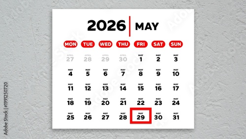 The date May 29th marked with a red cursor on a wall calendar 2026