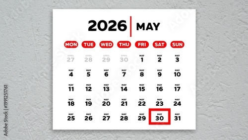 The date May 30th marked with a red cursor on a wall calendar 2026