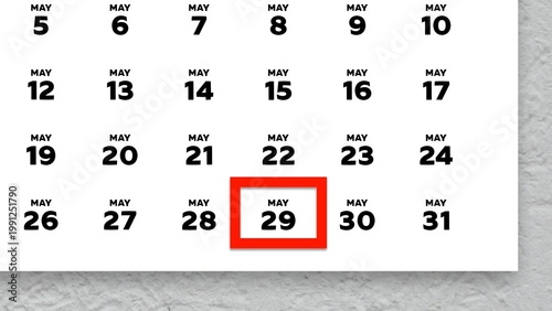 Close-up of the date May 29th marked with a red cursor on the wall calendar 2026