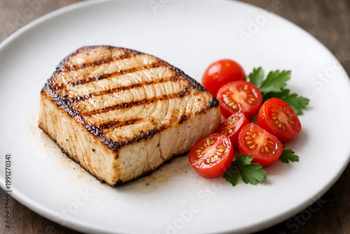 A premium photograph featuring a thick swordfish steak grilled to a tender, slightly firm texture with subtle grill marks.