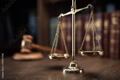 Scales of justice with judge gavel and law books in a courtroom, legal system and authority concept